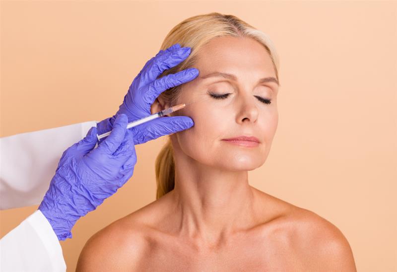 Close-up of a face after refined injectable treatment, showing balanced natural features